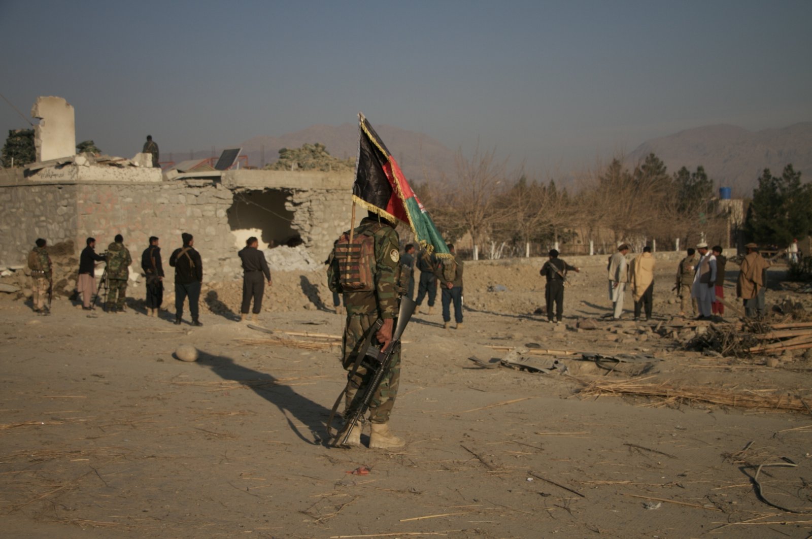Afghan police officials inspect the scene of a suicide car bomb blast that targeted a police outpost on the outskirts of Khogyani district, Nangarhar province, Afghanistan, Feb. 7, 2021. (Getty Images)