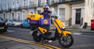 A delivery driver from Getir, Turkey's second unicorn, works next to his bike, London, U.K., Jan. 27, 2021. (Photo Courtesy of Getir)