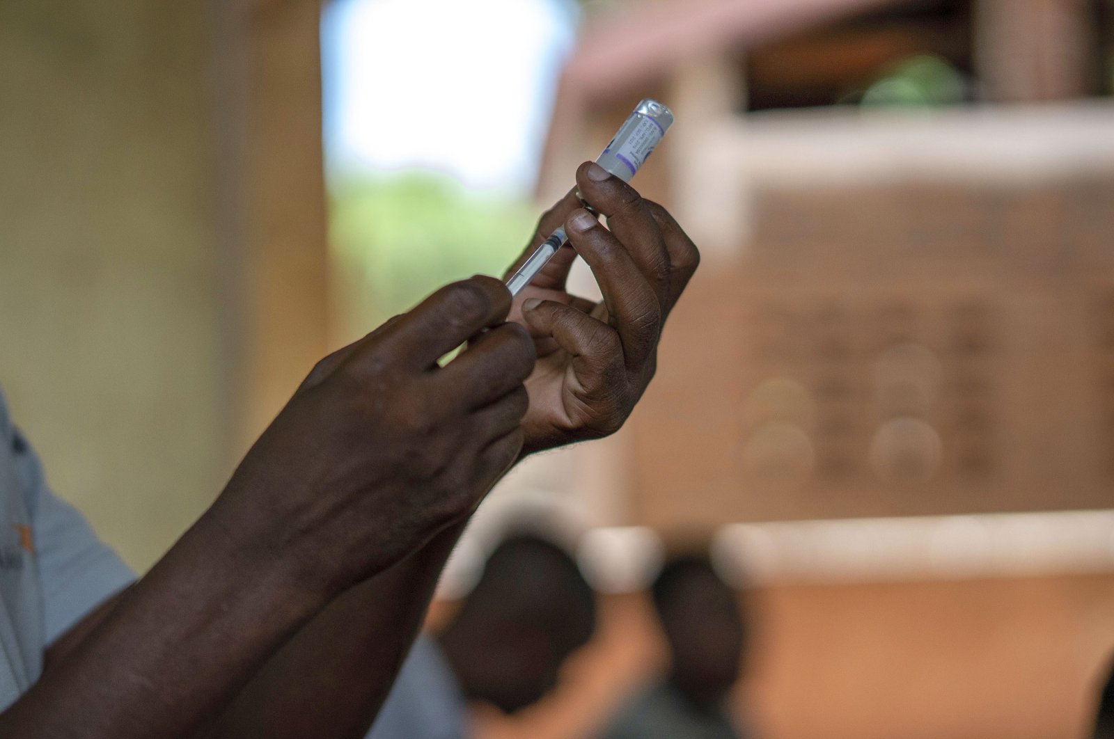 Health officials prepare to vaccine residents of the Malawi village of Tomali, where young children became test subjects for the world's first vaccine against malaria, Dec. 11, 2019. (AP Photo)