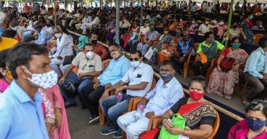 People wait to receive a COVID-19 shot at a vaccination center in Mumbai, India, April 21, 2021. (EPA Photo)