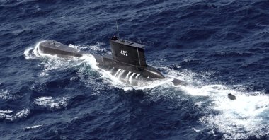 Indonesian Navy submarine KRI Nanggala sails in the waters off Tuban, East Java, Indonesia, as seen in this aerial photo taken from an Indonesian Navy helicopter from the 400 Air Squadron, Oct. 6, 2014. (AP Photo)