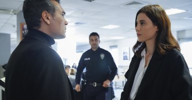 A still shot from "Sadakatsiz" shows actor Caner Cindoruk as Volkan (L) and actress Cansu Dere as Asya.