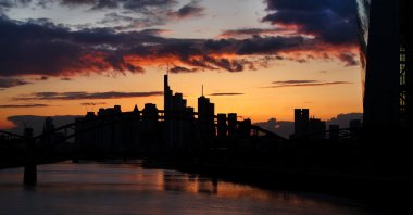 The European Central Bank (ECB) and the skyline with its financial district are seen during sunset as the spread of the coronavirus disease (COVID-19) continues in Frankfurt, Germany, April 13, 2021. (Reuters Photo)