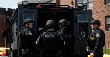Law enforcement officers stand near a shooting scene in Hempstead, New York, U.S., April 20, 2021. (Reuters File Photo)