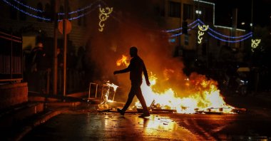 Streets burn as members of the Israeli security forces are deployed during clashes with Palestinian protesters outside Damascus Gate in the Old City, East Jerusalem, occupied Palestine, April 22, 2021. (AFP Photo)