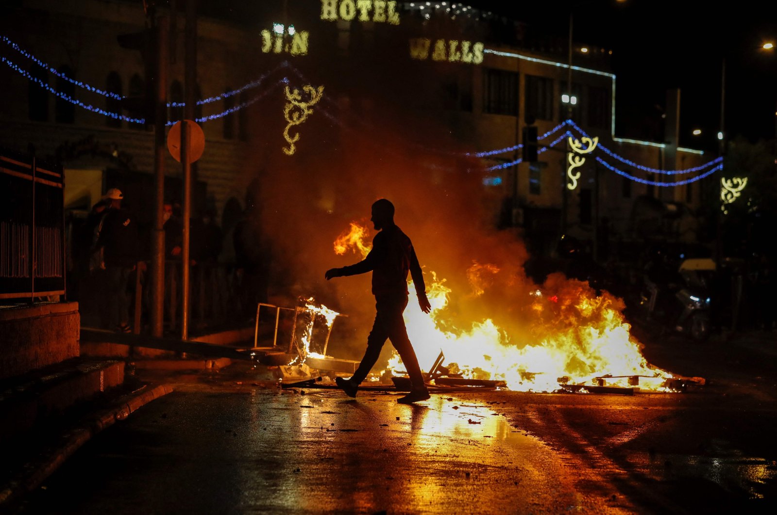 Streets burn as members of the Israeli security forces are deployed during clashes with Palestinian protesters outside Damascus Gate in the Old City, East Jerusalem, occupied Palestine, April 22, 2021. (AFP Photo)