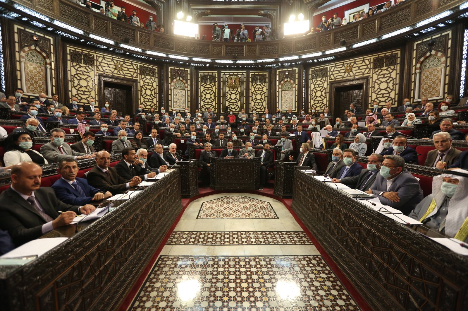 A general view of members of the Syrian Parliament attending an extraordinary session in Damascus, Syria, April 18, 2021. (EPA Photo)