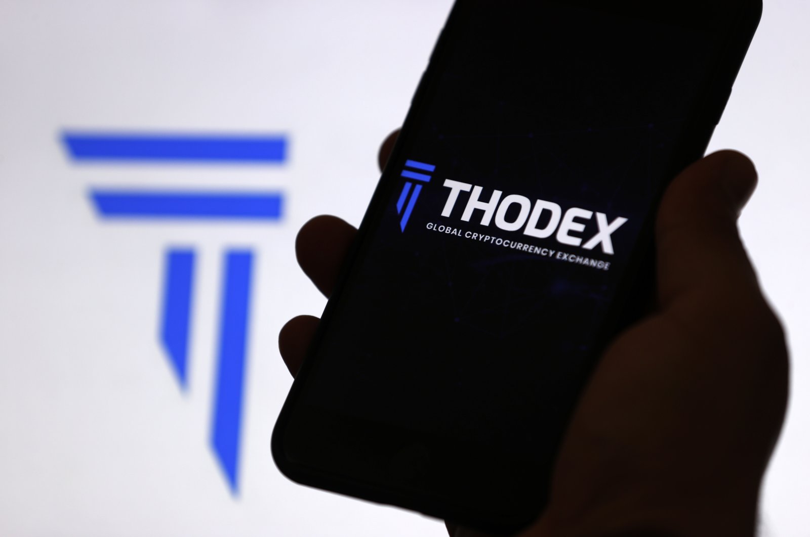 The Thodex cryptocurrency exchange logo is displayed on a mobile phone screen, April 22, 2021. (AA Photo)