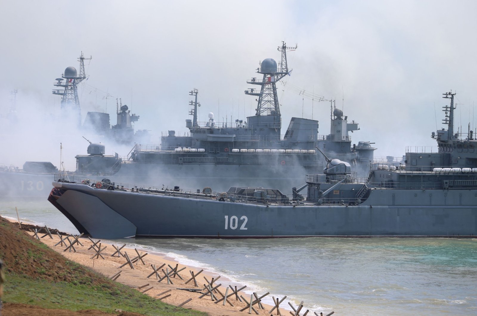 Russian forces landing ashore during a military drill along the Opuk training ground not far from the town of Kerch, on the Kerch Peninsula in the east of Crimea, in this handout picture released by the Russian Defense Ministry on April 22, 2021. (AFP Photo)