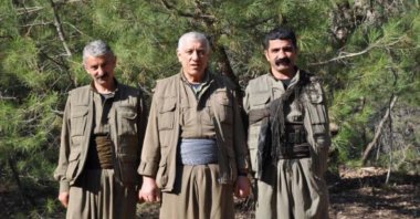 File photo shows PKK/KCK terrorist killed by Turkish security forces Dalokay Şanlı (L) standing with other members of the organization. (AA Photo) 