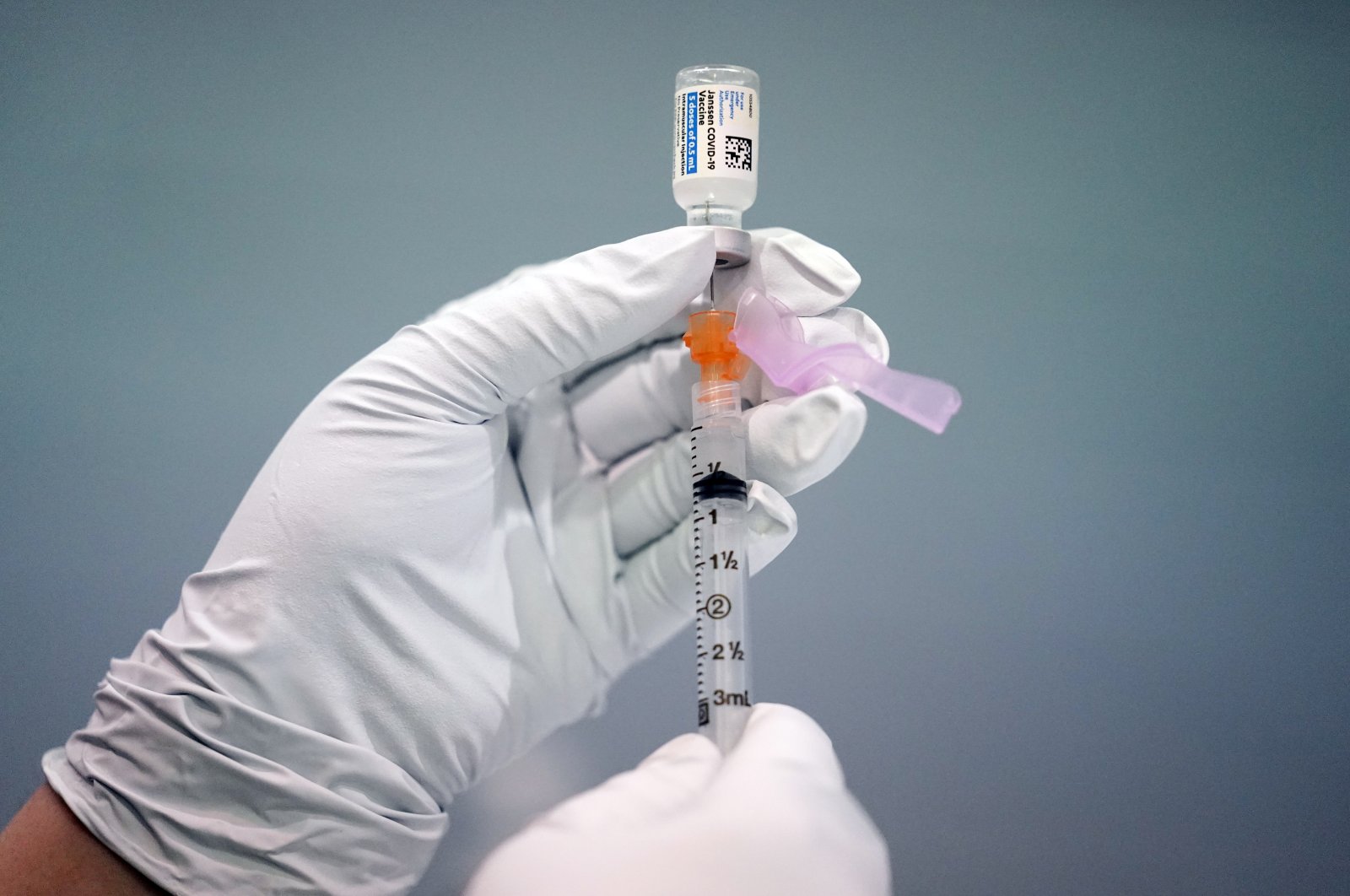 A member of the Philadelphia Fire Department prepares a dose of the Johnson & Johnson COVID-19 vaccine at a vaccination site setup at a Salvation Army location in Philadelphia, March 26, 2021. (AP Photo)