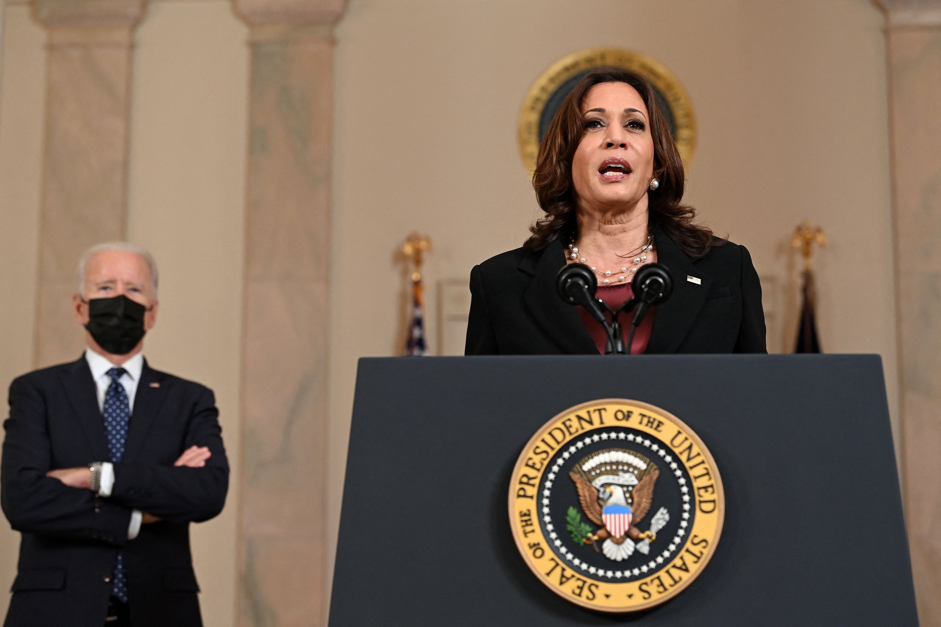 U.S. President Joe Biden (L) listens as Vice President Kamala Harris delivers remarks on the guilty verdict against former police officer Derek Chauvin at the White House in Washington, D.C., U.S., April 20, 2021. (AFP Photo)