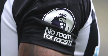 The "No room for racism" badge is seen on the shirt of a Newcastle United players, Newcastle, England, Sept. 20, 2020.