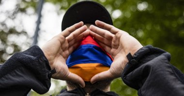 Armenians protest outside of the Turkish Embassy on the 106th anniversary of 1915 events in Washington, DC on April 24, 2021. (AFP)