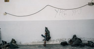 A rifle rests against a wall at a rear base used by PKK-linked YPG and YPJ terrorists near Tal Samin, Syria, Nov. 24, 2016. (Photo by Getty Images)