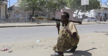 A Somali soldier loyal to commander Saney Abdulle, a break-away military faction, points a rocket-propelled grenade (RPG) on the streets of Fagah in northern Mogadishu, Somalia, April 25, 2021. (EPA Photo)