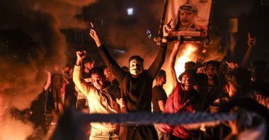 Palestinians chant slogans as they burn tires during a rally in support of Jerusalem demonstrators, in Gaza City, Palestine, April 24, 2021. (AFP)