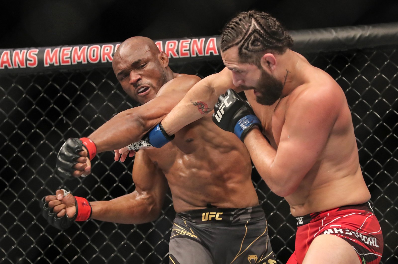 Nigeria's Kamaru Usman (L) fights the U.S.' Jorge Masvidal during the Welterweight Title bout of UFC 261 at VyStar Veterans Memorial Arena, Jacksonville, Florida, April 25, 2021. (AFP Photo)