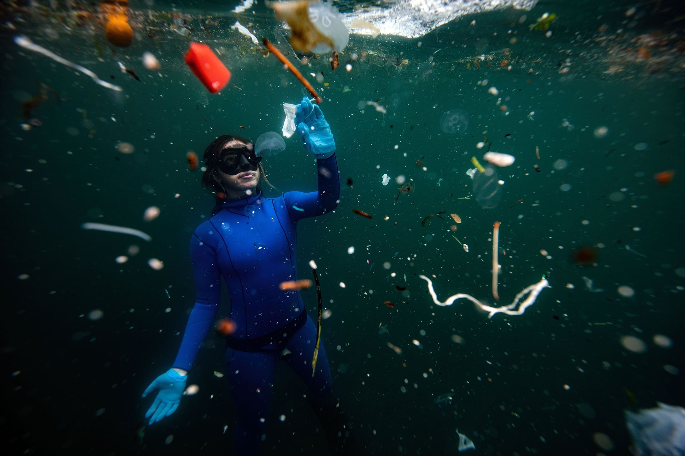 Face masks, gloves, fishing nets and various pieces of plastic pollute the Bosporus Strait in Istanbul. (AA Photo)