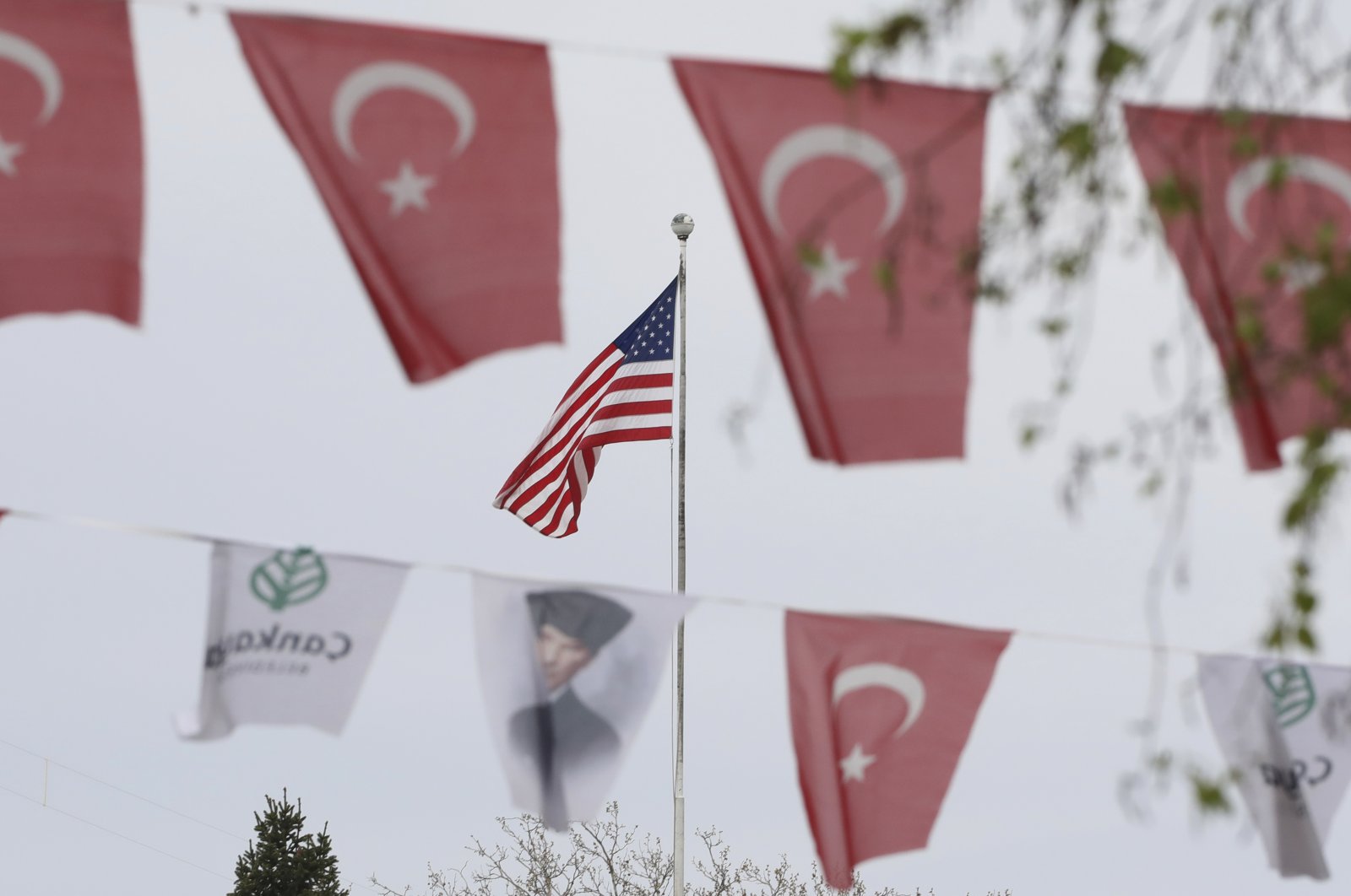 Turkish flags and banners depicting Mustafa Kemal Atatürk, the founder of modern Turkey, decorate a street outside the United States Embassy in Ankara, Turkey, April 25, 2021. (AP)