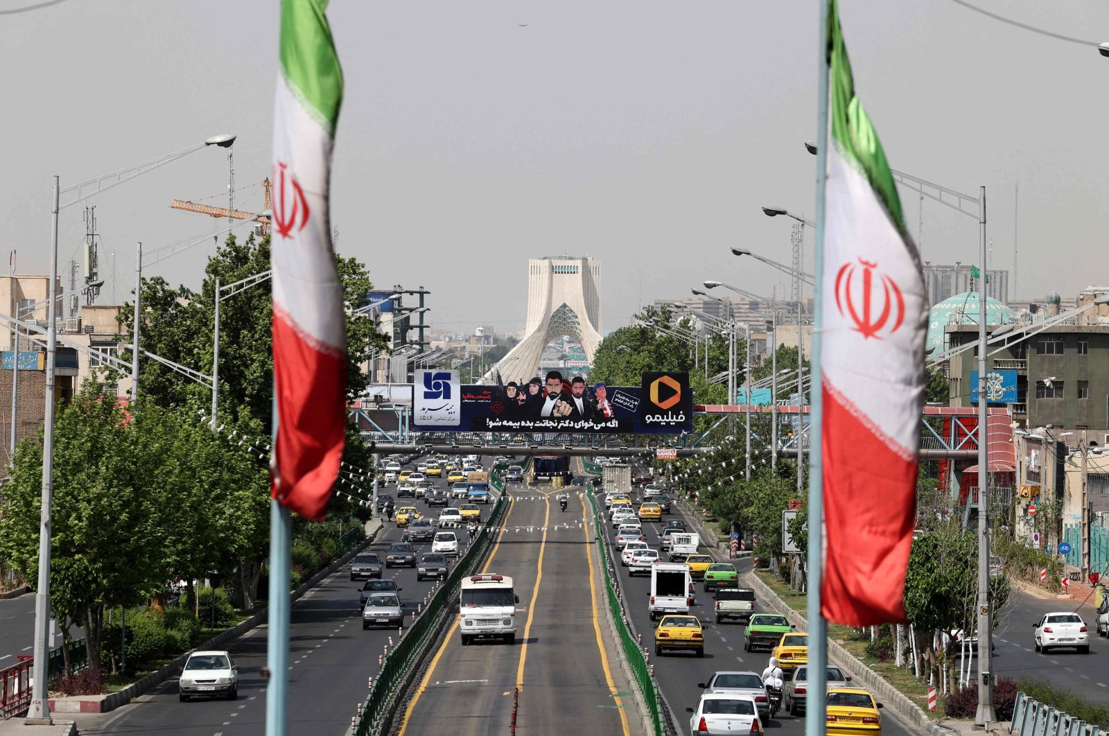 A view shows traffic on Azadi street in Iran's capital Tehran, April 20, 2021. (AFP)