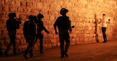 Israeli security forces approach a Palestinian protester outside the Damascus Gate in Jerusalem's Old City, April 23, 2021. (AFP Photo)