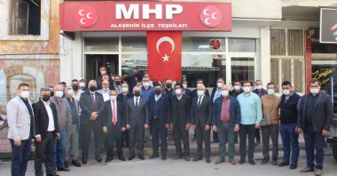 Resigned Good Party (IP) members pose with the local Nationalist Movement Party (MHP) organization in western Manisa province, Turkey, April 28, 2021. (AA Photo)