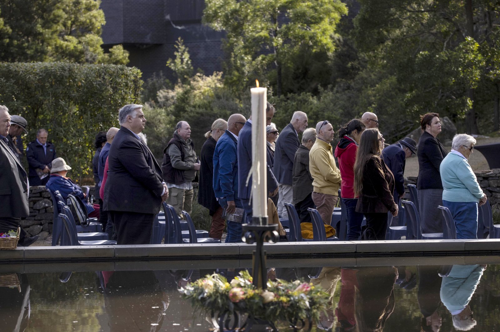 People attend a ceremony at Port Arthur as Australia marks the 25th anniversary of a lone gunman killing 35 people in Tasmania state in a massacre that galvanized the nation into tightening gun laws, Tasmania, Australia, April 28, 2021. (Pool via AP)