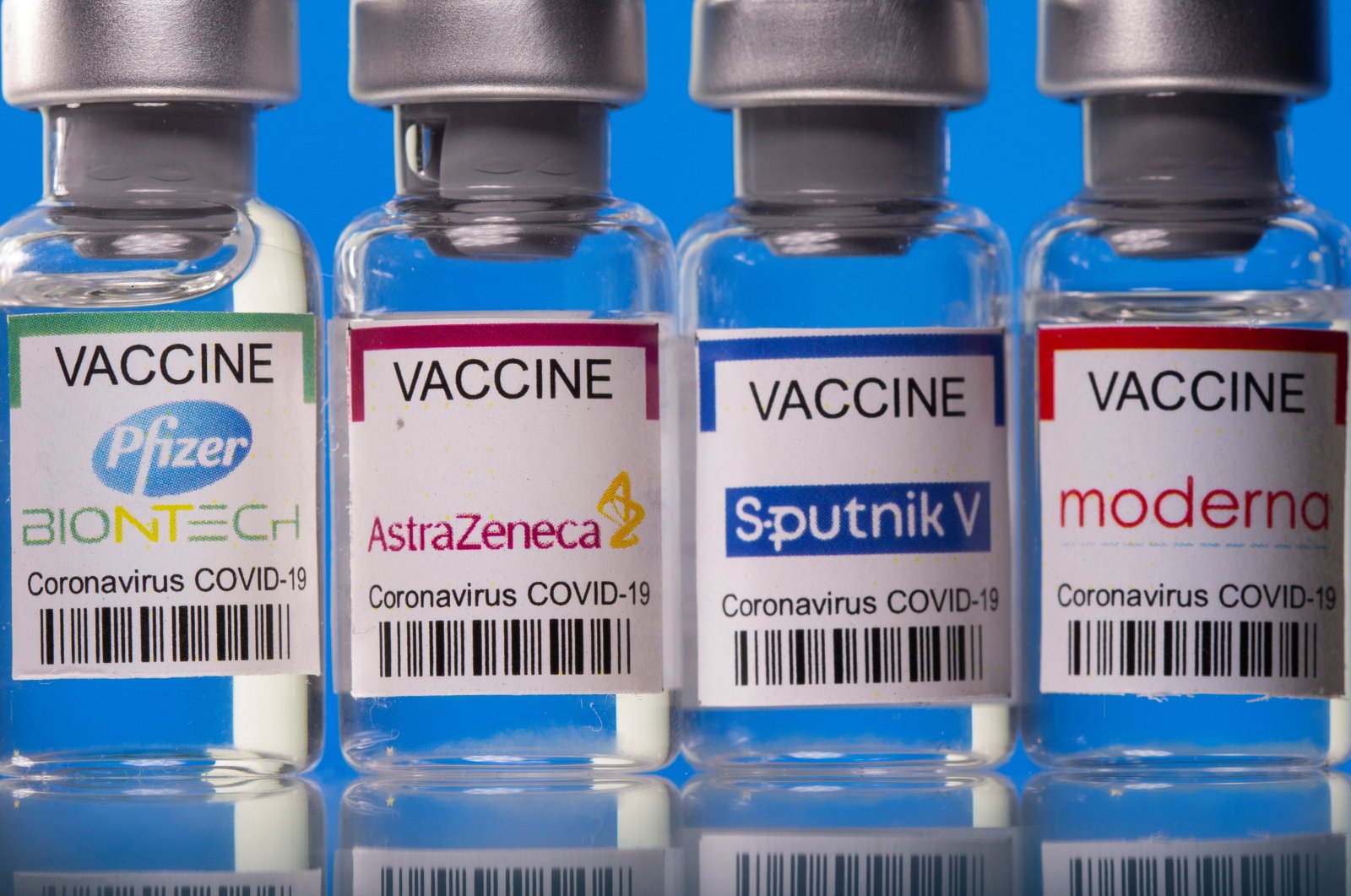 Vials with Pfizer-BioNTech, AstraZeneca, Sputnik V and Moderna coronavirus disease (COVID-19) vaccine labels stand side by side in this illustration picture taken March 19, 2021. (Reuters Photo)