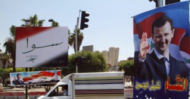 Campaign posters for the upcoming presidential election adorn a street in Damascus, Syria, May 12, 2014. (AP Photo)