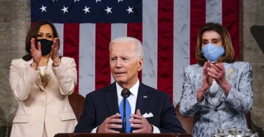 Vice President Kamala Harris and House Speaker Nancy Pelosi of Calif., stand and applaud as President Joe Biden addresses a joint session of Congress, Wednesday, April 28, 2021, in the House Chamber at the U.S. Capitol in Washington. (The Washington Post via AP)