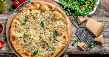 Pizza quattro formaggi, or four cheese pizza, is an iconic item on many menus. (Shutterstock Photo)
