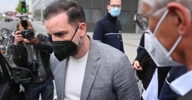 Former German footballer Christoph Metzelder (C) leaves the district court for the start of the trial against him on child pornography charges in Duesseldorf, western Germany, April 29, 2021. (AFP Photo)