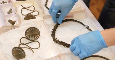 Bronze pieces of jewelry found in Alingsas, in Gothenburg, Sweden, April 29, 2021. (EPA Photo)