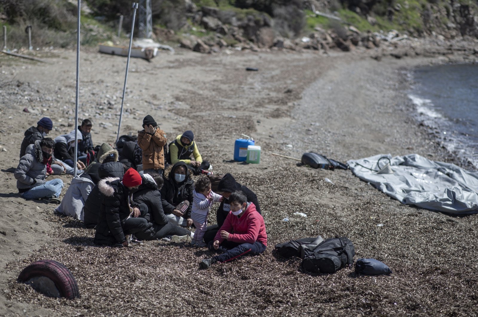 Migrants, being pushed back from Greece, arrive at the Ayvalık district in Balıkesir, Turkey, April 10, 2021 (EPA Photo)