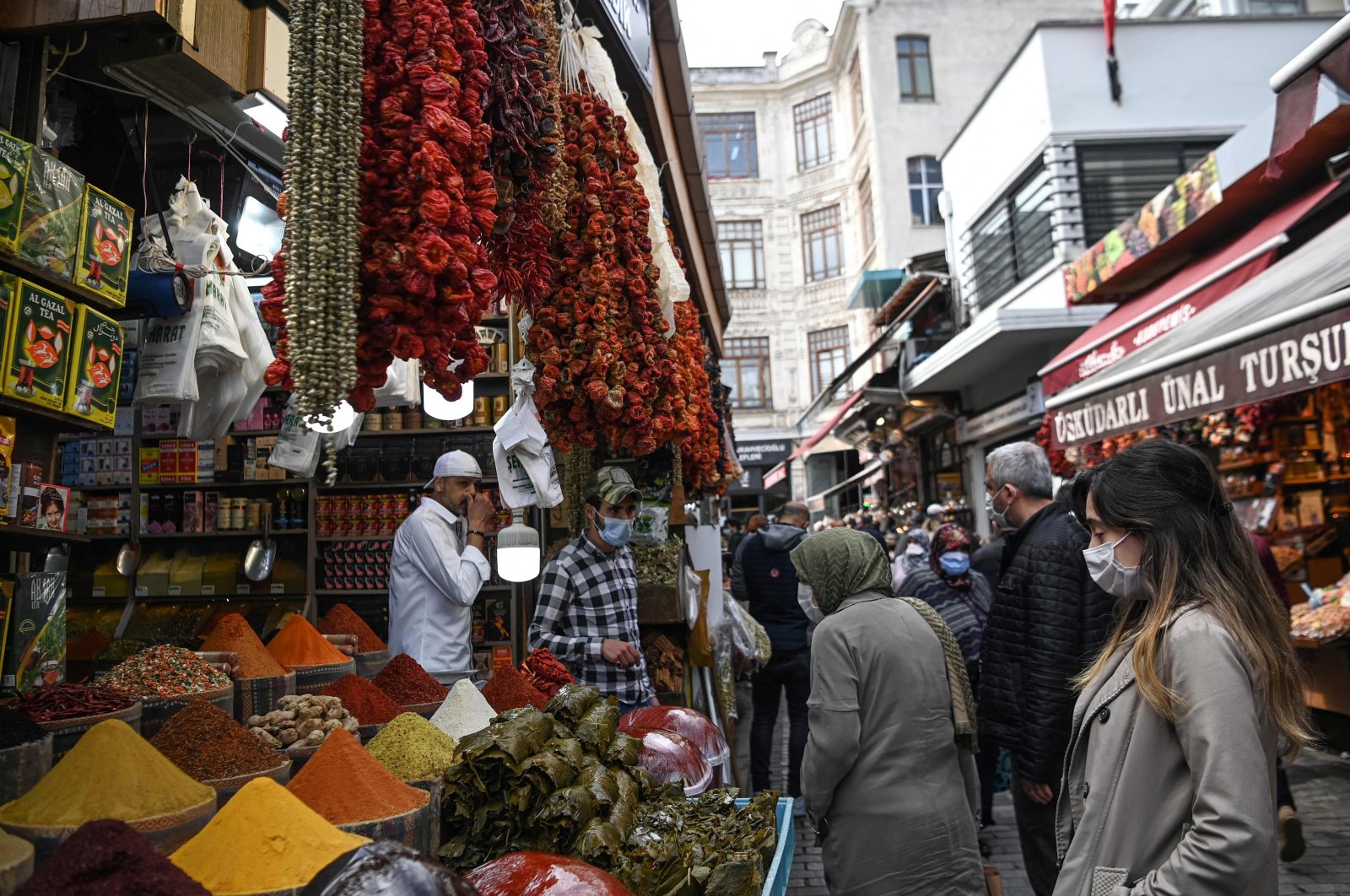 People shop near the Spice Bazaar in the Eminönü neighborhood in Istanbul, Turkey, April 27, 2021. (AFP Photo)
