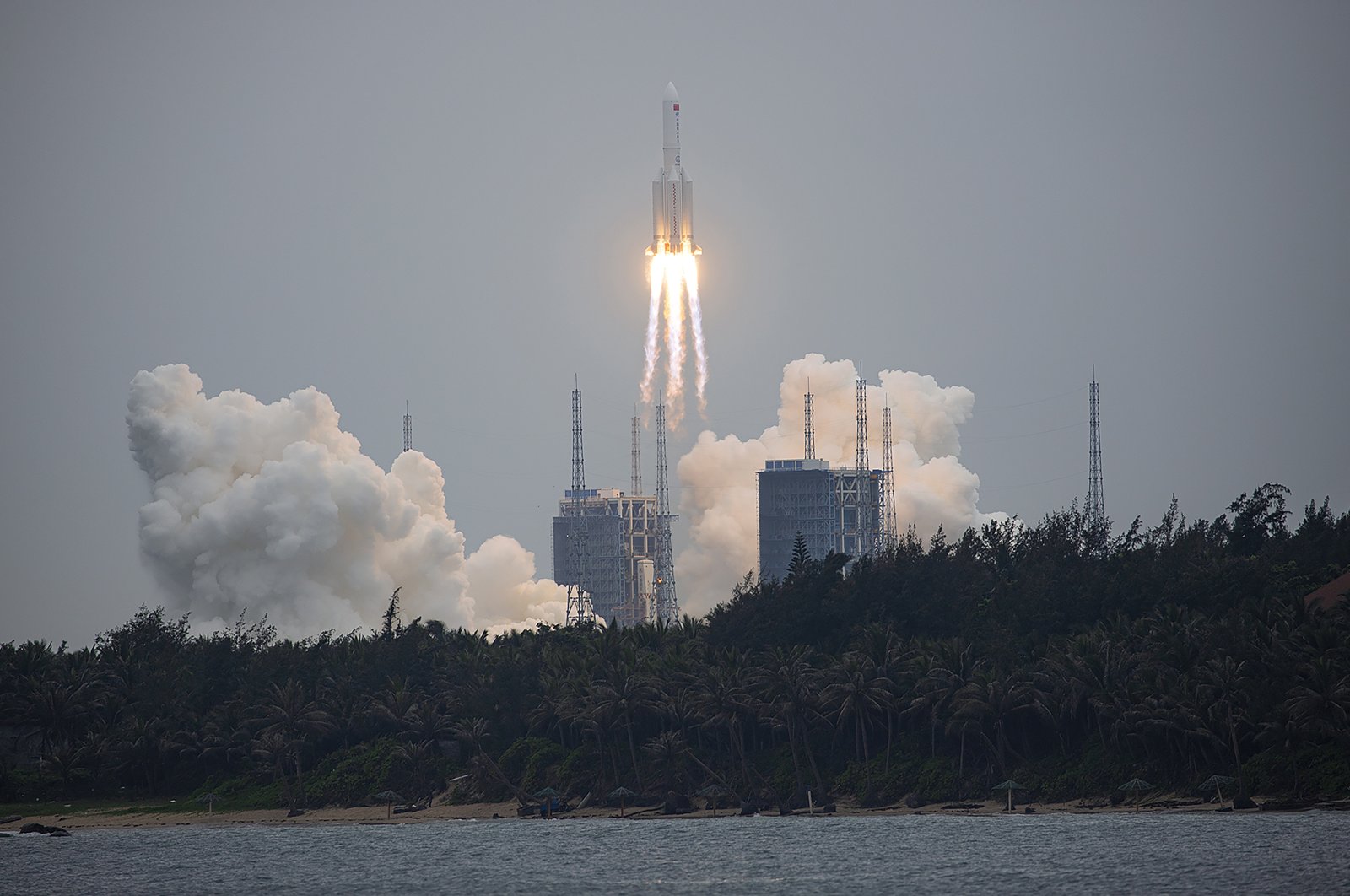 A Long March 5B rocket carrying a module for a Chinese space station lifts off from the Wenchang Spacecraft Launch Site in Wenchang in Hainan Province, southern China, April 29, 2021. (Chinatopix via AP)