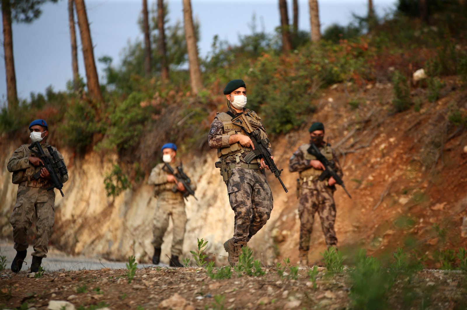 Police officers of the Special Operations Branch of the Provincial Security Directorate patrol the area on the dominant hills called "Bayraktepe" and "Sancaktepe" in the Amanos Mountains, Turkey, April 29, 2021. (AA Photo)