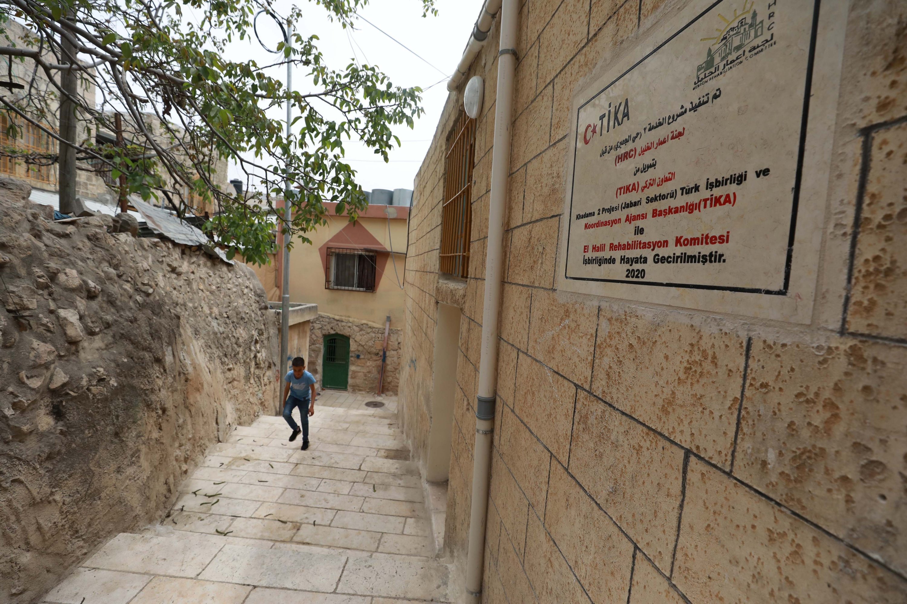 A plaque indicates a project by the Turkish Cooperation and Coordination Agency (TIKA) and the Hebron Rehabilitation Committee to restore historical houses in Hebron, Palestine, April 30, 2021. (AA Photo)