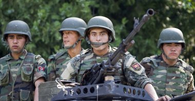 Kyrgyz army soldiers look on from their truck before leaving for a mission in Osh, Kyrgyzstan, June 29, 2010. (Reuters Photo)