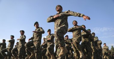 Newly graduated Afghan National Army march during their graduation ceremony after a three-month training program at the Afghan Military Academy in Kabul, Afghanistan, Nov. 29, 2020. (AP Photo)