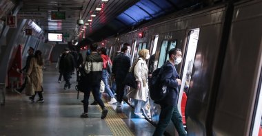 People take a subway during the early hours of a COVID-19 lockdown in Istanbul, Turkey, April 30, 2021. (DHA Photo)