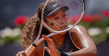 Japan's Naomi Osaka returns the ball to Japan's Misaki Doi during their match at the Madrid Open tennis tournament in Madrid, Spain, April 30, 2021. (AP Photo)