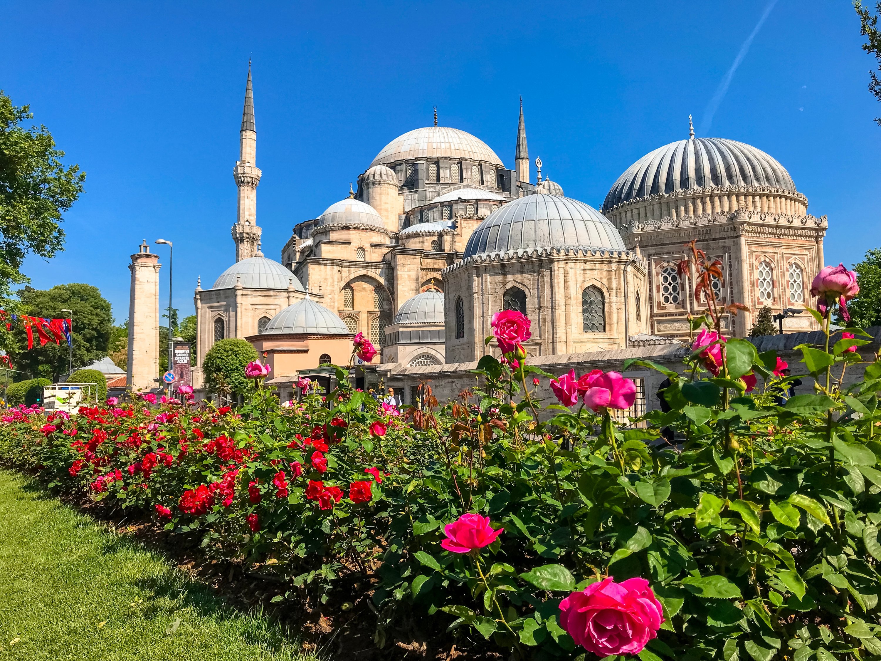 Exterior view of the Şehzade Mosque, commissioned by Ottoman Sultan Suleiman I, with roses in its garden in the Fatih district of Istanbul, Turkey, May 15, 2018. (Shutterstock Photo)