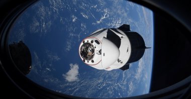 The SpaceX Crew Dragon capsule Endeavor, carrying four astronauts, approaches the International Space Station orbiting the Earth, April 24, 2021. (Reuters Photo)