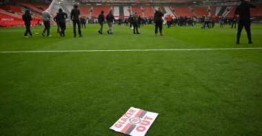 Supporters protest against Manchester United's owners inside the Old Trafford stadium in Manchester, northwest England, May 2, 2021. (AFP Photo)