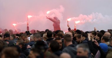 Ajax supporters burn flares in Amsterdam as they celebrate their team winning its 35th national title following the Dutch Eredivisie football match between Ajax Amsterdam and FC Emmen, Amsterdam, Netherlands, May 2, 2021. (AFP Photo)