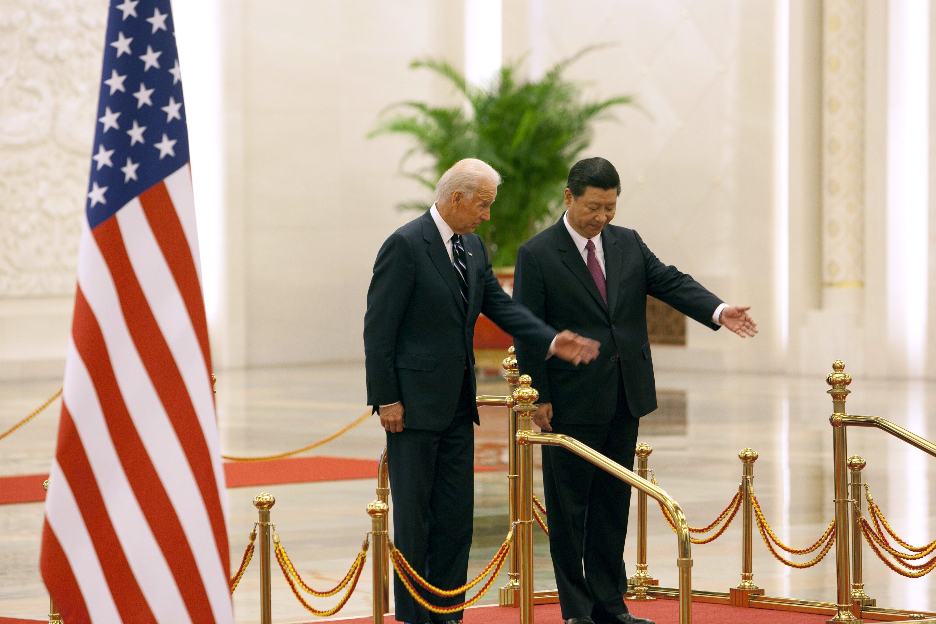 China's then Vice President Xi Jinping (R) attends a welcoming ceremony with then U.S. Vice President Joe Biden at the Great Hall of the People in Beijing, China, Aug. 18, 2011. (Photo by Getty Images)