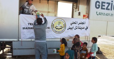 A mobile kitchen distributed iftar meal in northern Syria's Tal Abyad, May 3, 2021. (AA Photo)