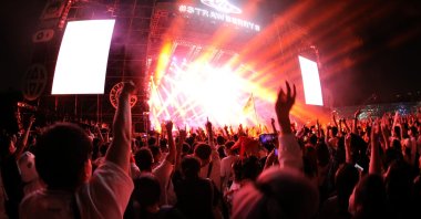 Fans attend a performance of a rock band at the Strawberry Music Festival during the Labor Day holiday in Wuhan, Hubei Province, China, May 1, 2021. (Reuters Photo)